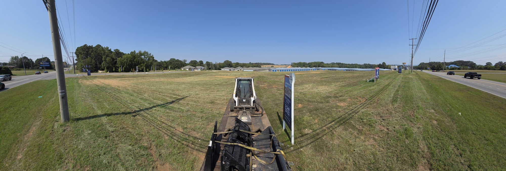 Panoramic view of a large field cut with the brush cutter